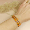 Bracelet fin en cuir orange