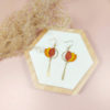 Boucles d'oreilles en cuir orange pailleté